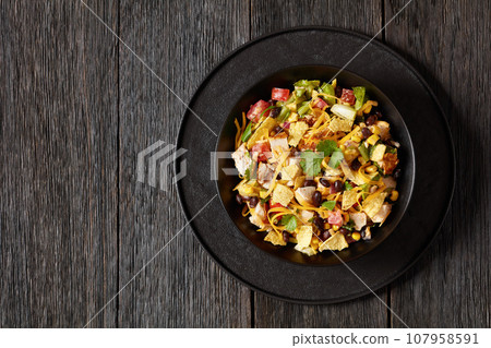 mexican rotisserie chicken salad in black bowl 107958591