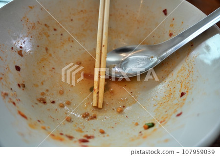 The Empty blow after eating finished. empty blow with chopstick. 107959039