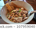 The noodles with pork and meatballs in spicy soup or Tom yum noodles in Asian style 107959040