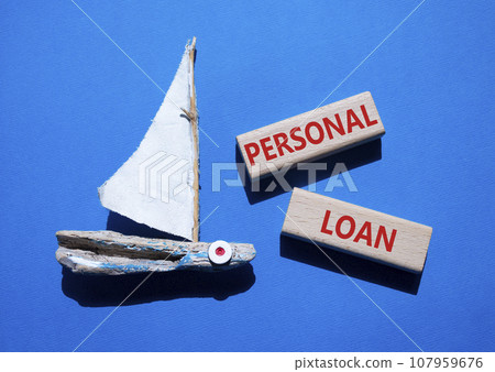 Personal Loan symbol. Concept word Personal Loan on wooden blocks. Beautiful blue background with boat. Business and Personal Loan concept. Copy space 107959676