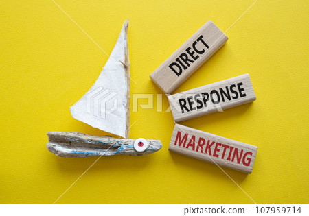 Direct Response Marketing symbol. Concept words Direct Response Marketing on wooden blocks. Beautiful yellow background with boat. Business and Direct Response Marketing concept. Copy space. Direct Response Marketing symbol. Concept words Direct Response Marketing on wooden blocks. Beautiful yellow background with boat. Business and Direct Response Marketing concept. Copy space. 107959714