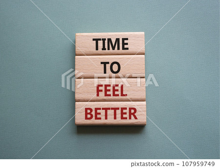 Time to feel better symbol. Wooden blocks with words Time to feel better. Beautiful grey green background. Medicine and Time to feel better concept. Copy space. 107959749