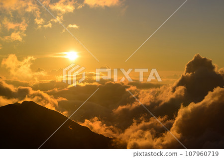 beautiful clouds illuminated by the setting sun beautiful clouds illuminated by the setting sun 107960719