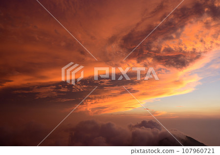 beautiful clouds illuminated by the setting sun beautiful clouds illuminated by the setting sun 107960721