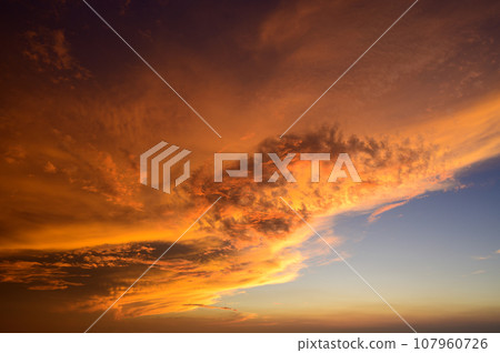 beautiful clouds illuminated by the setting sun beautiful clouds illuminated by the setting sun 107960726