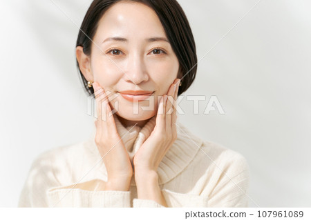 A woman in a white sweater A woman in a white sweater 107961089