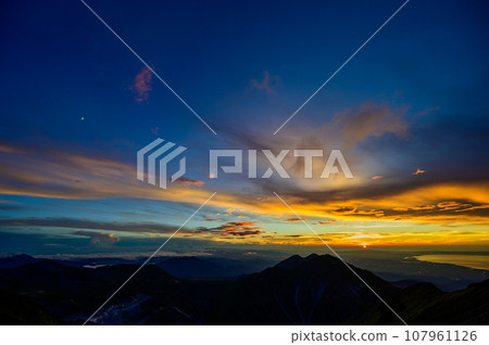 beautiful clouds illuminated by the setting sun beautiful clouds illuminated by the setting sun 107961126