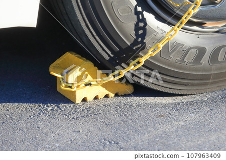 Large bus tires with wheels chocked Large bus tires with wheels chocked 107963409