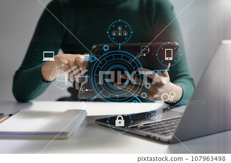Person using smartphone, tablet  with SDK icon on virtual screen. SDK Software development kit programming language technology concept in office. 107963498