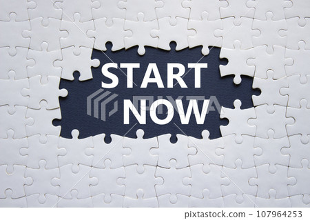 Start now symbol. White puzzle with words Start now. Beautiful dark blue background. Business and Start now concept. Copy space. Start now symbol. White puzzle with words Start now. Beautiful dark blue background. Business and Start now concept. Copy space. 107964253