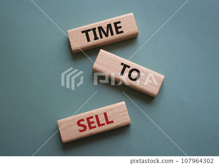 Time to Sell symbol. Concept words Time to Sell on wooden blocks. Beautiful grey green background. Business and Time to Sell concept. Copy space. Time to Sell symbol. Concept words Time to Sell on wooden blocks. Beautiful grey green background. Business and Time to Sell concept. Copy space. 107964302