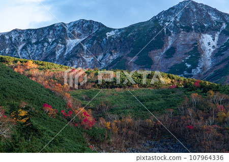 Hokkaido Autumn leaves of Tokachidake mountain range (evening view) 107964336