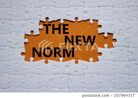 The new norm symbol. Concept words The new norm on white puzzle. Beautiful orange background. Business and The new norm concept. Copy space. 107964337