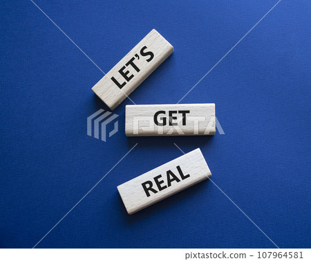 Lets get real symbol. Concept words Lets get real on wooden blocks. Beautiful deep blue background. Business and Lets get real concept. Copy space. 107964581