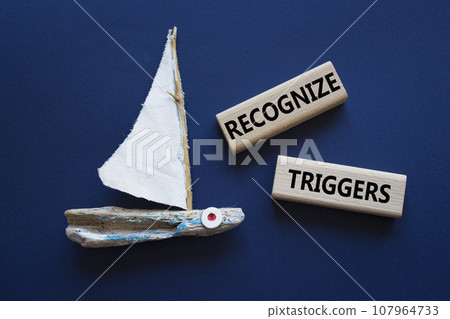 Recognize triggers symbol. Concept words Recognize triggers on wooden blocks. Beautiful deep blue background with boat. Business and Recognize triggers concept. Copy space. Recognize triggers symbol. Concept words Recognize triggers on wooden blocks. Beautiful deep blue background with boat. Business and Recognize triggers concept. Copy space. 107964733