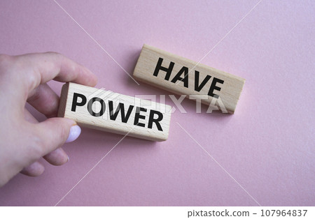 Have power symbol. Wooden blocks with words have power. Businessman hand. Beautiful pink background. Business and have power concept. Copy space. Have power symbol. Wooden blocks with words have power. Businessman hand. Beautiful pink background. Business and have power concept. Copy space. 107964837