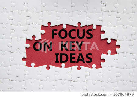 Focus on Key Ideas symbol. Concept word Focus on Key Ideas on white puzzle. Beautiful red background. Business and Focus on Key Ideas concept. Copy space Focus on Key Ideas symbol. Concept word Focus on Key Ideas on white puzzle. Beautiful red background. Business and Focus on Key Ideas concept. Copy space 107964979