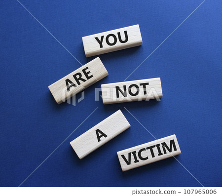 You are not your a victim. Wooden blocks with words You are not a victim. Beautiful deep blue background. Business and You are not a victim. Copy space. You are not your a victim. Wooden blocks with words You are not a victim. Beautiful deep blue background. Business and You are not a victim. Copy space. 107965006