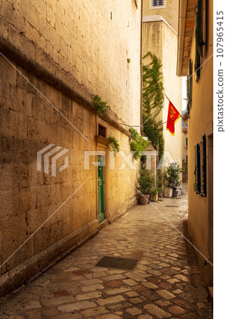 Narrow street, old town of Kotor, Montenegro Narrow street, old town of Kotor, Montenegro 107965415