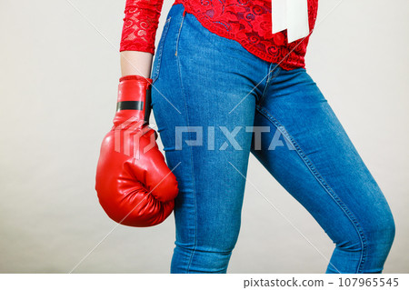 Woman wearing boxing glove Woman wearing boxing glove 107965545