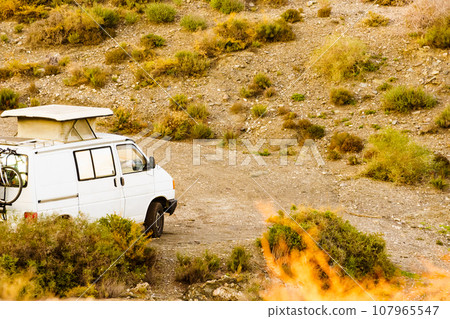 Van with roof top tent camping on nature 107965547