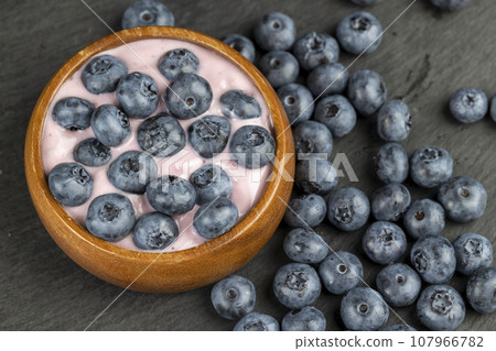fresh blueberry-flavored yogurt with ripe blueberries 107966782