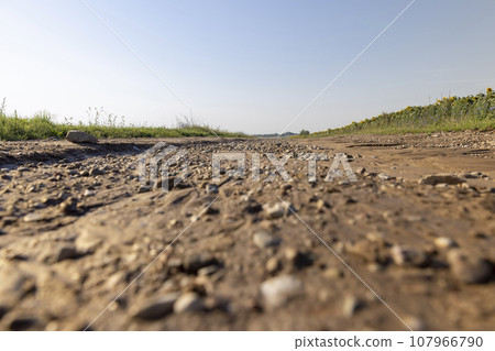 landslides on a country road after heavy rains and rains in summer 107966790