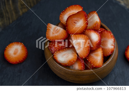 pieces of ripe strawberries of red color 107966813
