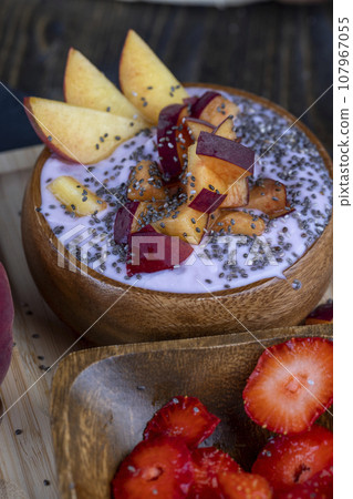 fresh yogurt made from milk with pieces of strawberries 107967055