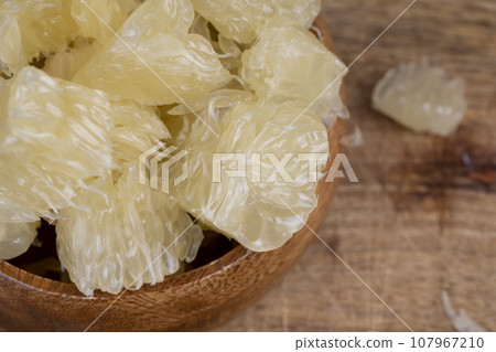 peeled pomelo on the table, close up 107967210