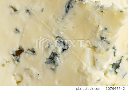 Cheese with blue mold cut into pieces Cheese with blue mold cut into pieces 107967342