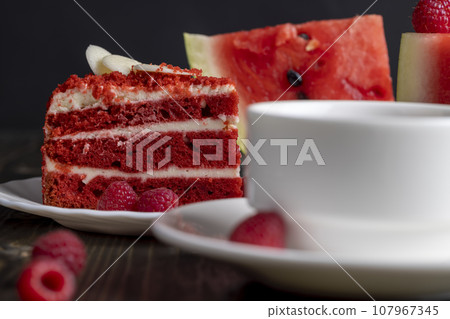 Red cake with cream and raspberry flavor 107967345