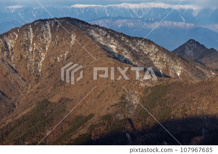 Mt. Misakakuro and Mt. Shakagatake in the morning seen from Mt. Mitsutoge and Mt. Kaiun Mt. Misakakuro and Mt. Shakagatake in the morning seen from Mt. Mitsutoge and Mt. Kaiun 107967685