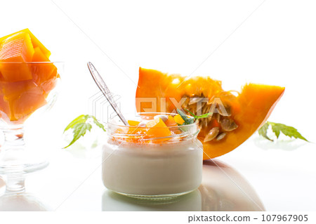 Homemade yogurt with pieces of pumpkin marmalade. 107967905