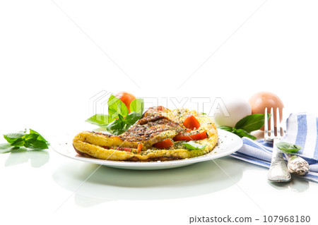 Stuffed omelette with tomatoes isolated on white background. 107968180