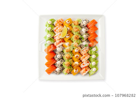 Assorted sushi big set on a white plate isolated. A variety of Japanese sushi. Assorted sushi big set on a white plate isolated. A variety of Japanese sushi. 107968282