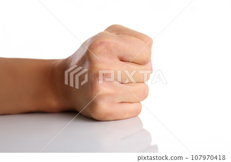 Male clenched fist isolated on white background Male clenched fist isolated on white background 107970418