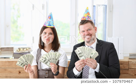A man and a woman enjoy light money 107970467