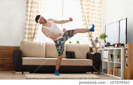 Young handsome man in shorts and 107970487