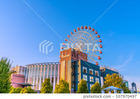 Yokohama cityscape in Japan October. In front of Center Kita Station, view of the Ferris wheel and Tsuzuki Hankyu, etc., reflected in the blue sky and sunset Yokohama cityscape in Japan October. In front of Center Kita Station, view of the Ferris wheel and Tsuzuki Hankyu, etc., reflected in the blue sky and sunset 107970497