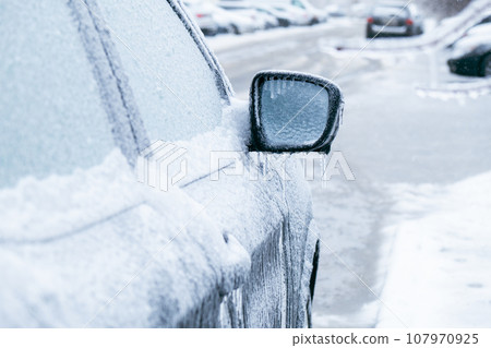 car covered with ice after snowstorm car covered with ice after snowstorm 107970925