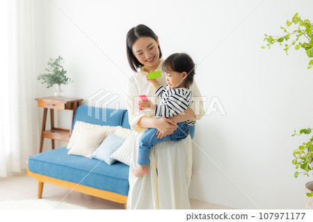 A mother holding a child A mother holding a child 107971177
