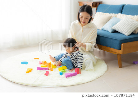A mother holding a child A mother holding a child 107971184