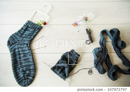 Set for hand knitting warm winter socks made of natural woolen yarn. Set for hand knitting warm winter socks made of natural woolen yarn. 107972797
