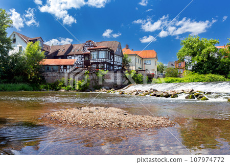 Old half-timbered houses on the banks of a canal in Marburg. Old half-timbered houses on the banks of a canal in Marburg. 107974772