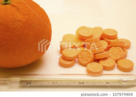 Mercury thermometer with tablets and orange - vitamin, protection, coronavirus, covid19 107974909
