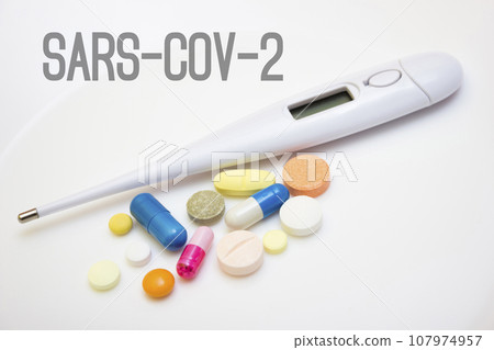 Electronic thermometer with tablets, capsules - protection, coronavirus, covid19, lettering sars-cov-2 Electronic thermometer with tablets, capsules - protection, coronavirus, covid19, lettering sars-cov-2 107974957