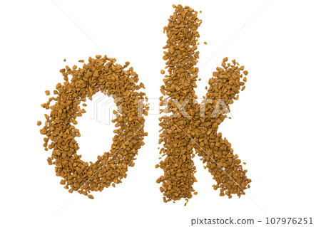 Dry instant coffee granules in the shape of a ok sign - brown texture Dry instant coffee granules in the shape of a ok sign - brown texture 107976251