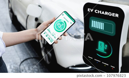 Smartphone display battery status interface by smart EV app. Peruse Smartphone display battery status interface by smart EV app. Peruse 107976823