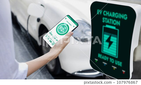 Smartphone display battery status interface by smart EV app. Peruse Smartphone display battery status interface by smart EV app. Peruse 107976867